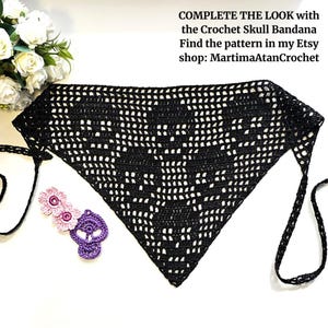 May include: A black triangular crochet bandana featuring a skull pattern, with thin ties on each side. Beside it are two small crochet flowers and a purple crochet skull. Text reads: COMPLETE THE LOOK with the Crochet Skull Bandana Find the pattern in my Etsy shop: MartimaAtanCrochet
