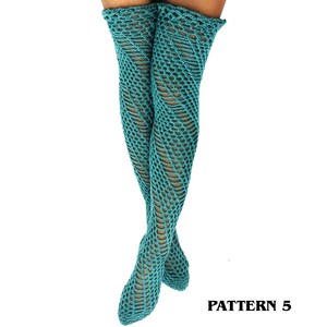May include: A pair of teal thigh-high socks featuring an intricate openwork crochet pattern with a diagonal, swirling design. The socks extend from the upper thigh down to the feet, showcasing a consistent, textured knit structure throughout.