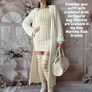 May include: A cream-colored crochet outfit, including a dress, thigh-high leg warmers, a long cardigan, and a handbag. The text on the image reads: Complete your outfit with crocheted dress, cardigan or bag. Patterns are available in my shop Martima Atan Crochet.