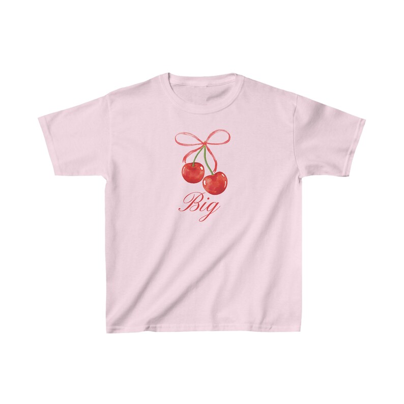 May include: Pink t-shirt with a graphic of two red cherries tied together with a pink ribbon. The text "Big" is written below the cherries.