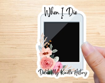 May include: A white sticker with a black and white image of a tablet with the text "When I Die Delete My Kindle History" and a floral design in pink and green.