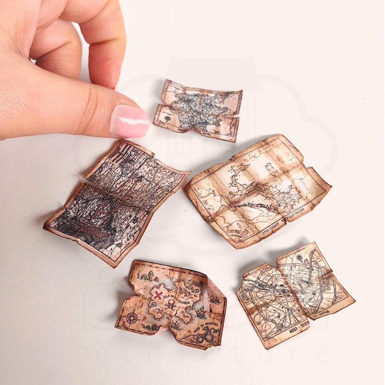 1:12 scale Victorian dollhouse miniature ephemera and accessory set. This printable digital kit features a vintage steamer trunk, floral photo album, personal journal, and over 200 nostalgic paper treasures. Designed by LittleBethMiniature for vintage dollhouse collectors.
