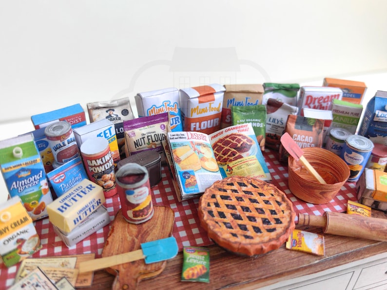 It is a Dollhouse Miniature Baking/ Cooking set that includes various items such as 45 different pieces Miniature Food, Mini Grocery boxes, Cooking Ingredients, Kitchenware, Recipes and Cookbook. Download PDF printables and get started making.