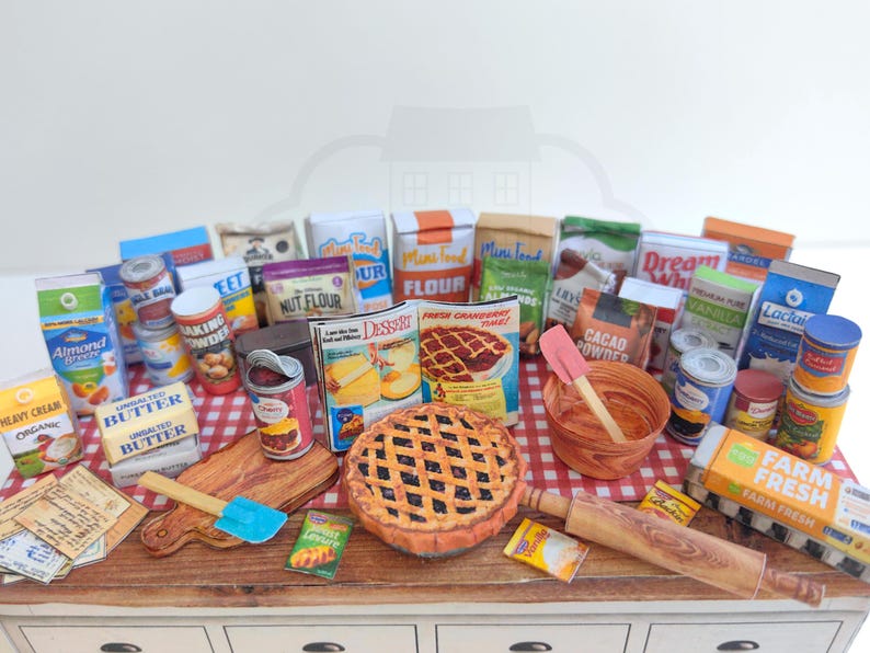 It is a Dollhouse Miniature Baking/ Cooking set that includes various items such as 45 different pieces Miniature Food, Mini Grocery boxes, Cooking Ingredients, Kitchenware, Recipes and Cookbook. Download PDF printables and get started making.