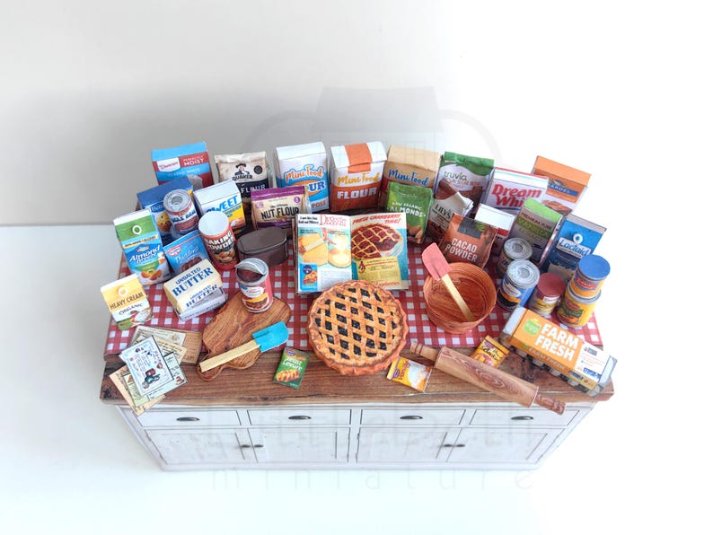 It is a Dollhouse Miniature Baking/ Cooking set that includes various items such as 45 different pieces Miniature Food, Mini Grocery boxes, Cooking Ingredients, Kitchenware, Recipes and Cookbook. Download PDF printables and get started making.