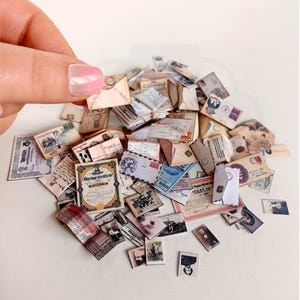 1:12 scale Victorian dollhouse miniature ephemera and accessory set. This printable digital kit features a vintage steamer trunk, floral photo album, personal journal, and over 200 nostalgic paper treasures. Designed by LittleBethMiniature for vintage dollhouse collectors.