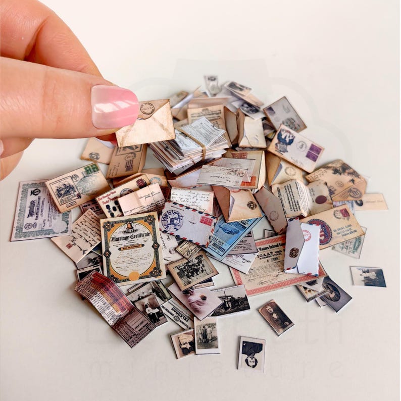 1:12 scale Victorian dollhouse miniature ephemera and accessory set. This printable digital kit features a vintage steamer trunk, floral photo album, personal journal, and over 200 nostalgic paper treasures. Designed by LittleBethMiniature for vintage dollhouse collectors.