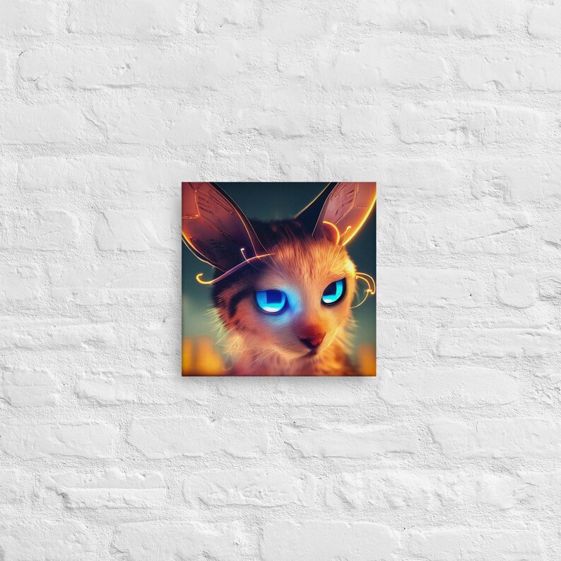 May include: Square canvas art featuring a stylized cat with large, glowing blue eyes and long, pointed ears. The cat has a light brown and white fur pattern, with golden accents around the ears and head. The artwork is set against a dark background.