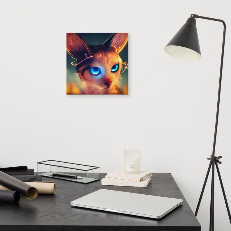 May include: A canvas print featuring a stylized cat with large, glowing blue eyes and intricate golden accents around the ears and eyes. The cat has a soft, furry appearance with warm, orange and brown tones. The background is a blurred mix of colors.