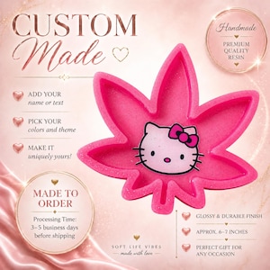May include: A pink resin tray in the shape of a cannabis leaf, featuring a Hello Kitty design. The tray is approximately 6-7 inches and has a glossy finish. The text "CUSTOM Made" is visible, along with other text.