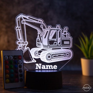 May include: White illuminated night light featuring an excavator design. The light comes with a remote control offering various colour options. The light is personalised with the name "Name".