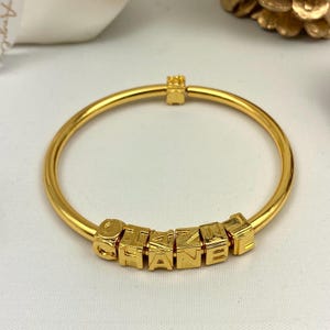 Chanel classic wording bangle bracelet