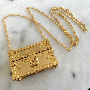 lv pendant brooch