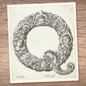 May include: A black and white engraving of the letter Q, surrounded by ornate floral designs and cherub faces. The letter is in a decorative font and the cherubs are depicted with wings and halos.