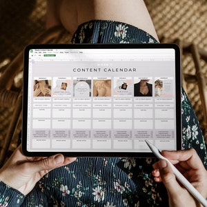 May include: A digital tablet displaying a "Content Calendar" spreadsheet. The calendar is organized in a grid format with sections for each day of the week, featuring images and text. A stylus is held near the screen, and the person is wearing a floral dress.