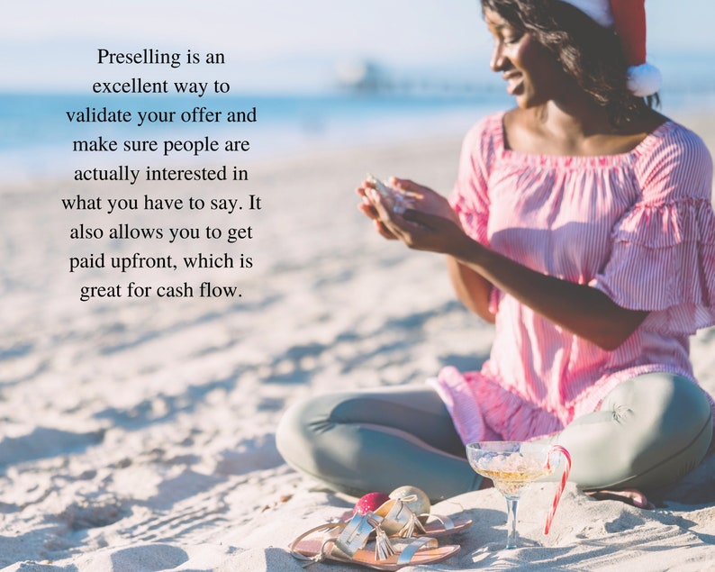 May include: A woman wearing a pink and white striped shirt and a Santa hat sits on a sandy beach. She is holding a small white object in her hands. The text "Preselling is an excellent way to validate your offer and make sure people are actually interested in what you have to say. It also allows you to get paid upfront, which is great for cash flow." is visible in the image.