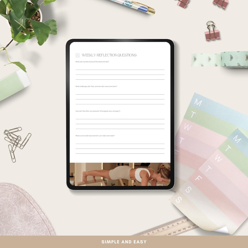 May include: A digital tablet displaying "WEEKLY REFLECTION QUESTIONS" with prompts for self-reflection. The image includes a woman doing a plank exercise. Additional items include paper clips, a pen, washi tape, and a pastel-colored notepad.