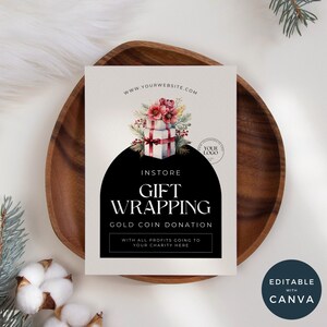 May include: A white sign with a black circle and text that says "INSTORE GIFT WRAPPING GOLD COIN DONATION WITH ALL PROFITS GOING TO YOUR CHARITY HERE". The sign has a watercolour illustration of a stack of wrapped gifts with red flowers and greenery.