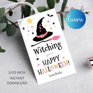 May include: A white gift tag with a black witch hat and pink broom. The text reads "Witching you a Happy Halloween! Love Emily".