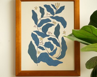 May include: A framed print of a blue and yellow floral design with a white background. The design features stylized leaves and flowers.