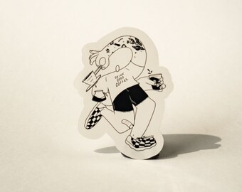 May include: Black and white sticker of a cartoon person wearing a shirt that says "Drink Good Coffee" and holding a cup of coffee. The person is wearing checkered shoes and has a tattoo on their arm.