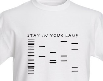 May include: White t-shirt with black text that reads "STAY IN YOUR LANE" and a graphic of lines representing lanes.