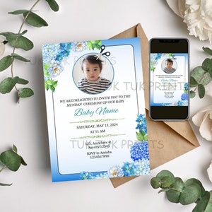 Könnte beinhalten: Eine blaue und weiße Babyparty-Einladung mit einem Foto eines kleinen Jungen, einer Schere und blauen Blumen. Die Einladung enthält den Text "We are delighted to invite you to the Mundan Ceremony of our baby [Baby Name] Saturday, May 13, 2024 at 11 AM 123, Anywhere st. Anycity 12345 RSVP to Amisha 1234567890".