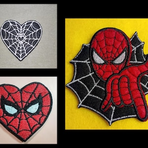 May include: Three embroidered patches featuring a black heart with a white spiderweb, a red heart with a black spiderweb and white eyes, and a red and black character with white eyes posed in front of a black spiderweb on a yellow background.