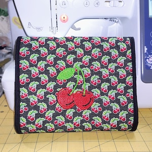Cherry Cosmetic Makeup Bag with Brush roll.. Large pocket bag with a 2nd  side zipper and attached brush roll holder..