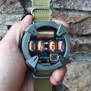 Nixie watch, Titanium handmade with γ, β and X-ray radiation dosimeter.