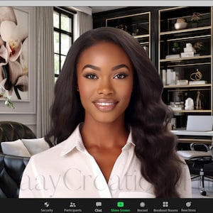 May include: A woman with long, dark hair is smiling at the camera. She is wearing a white shirt and is sitting in front of a black and gold bookcase. There are white orchids in the background.