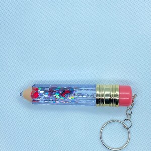 Snowglobe keychain with apple confetti