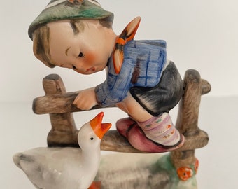 Hummel boy on fence with goose discount