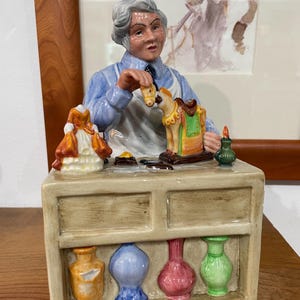 Royal Doulton Collectible Figurine of The China Repairer Made In England