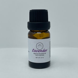 May include: A small amber glass bottle with a black cap, containing lavender essential oil. The label reads "Lavender Natural Essential Oil Huile Essentielle NET WT 10 ml".