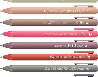 May include: A set of eight retractable ballpoint pens in various matte colors, each featuring a unique white inspirational quote and a small icon. The pens include phrases like Always Pray, Be Still, The Lord Is On My Side, and Trust In The Lord.