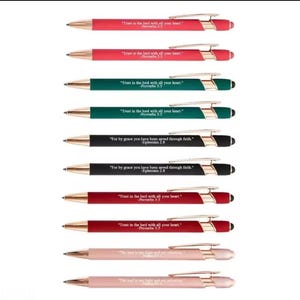 May include: A collection of ten retractable ballpoint pens in various colors including red, green, black, and light pink. Each pen features a metallic gold clip and tip, with white text printed on the barrel displaying religious scripture verses.
