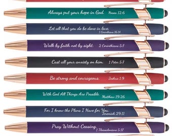 May include: A set of ten retractable ballpoint pens in various colors including red, teal, navy, purple, and black. Each pen features rose gold accents, a stylus tip, and a unique Bible verse printed in white script text along the barrel.