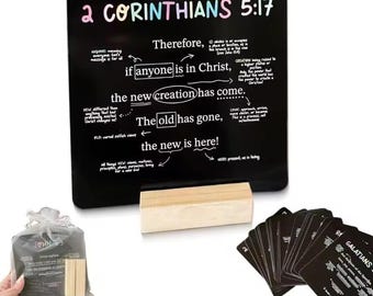 May include: A black chalkboard with the text "2 Corinthians 5:17" and related scripture. Includes a wooden eraser, a bag of small wooden blocks, and a stack of black cards with text.