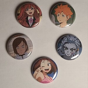 May include: Five round button pins featuring anime characters. The pins are colorful and feature different characters with various expressions.