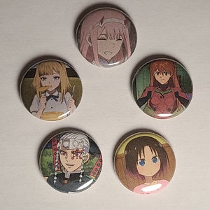 May include: Five round button pins featuring anime characters. The pins are colorful and feature various characters from different anime series.