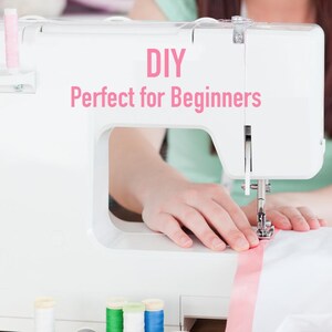 May include: A white sewing machine with pink thread and a pink ribbon. The text "DIY Perfect for Beginners" is displayed on the machine.