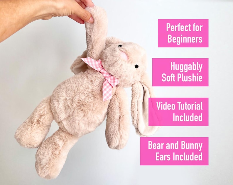 May include: A light brown plush bunny with pink gingham ribbon around its neck. The bunny is being held up by a hand. The text "Perfect for Beginners", "Huggably Soft Plushie", "Video Tutorial Included", and "Bear and Bunny Ears Included" is written in pink boxes on a white background.