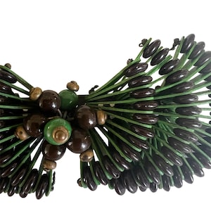 Miriam Haskell , three dimensional brooch, bake light glass and wood, green brown and gold colors 1940s or before.