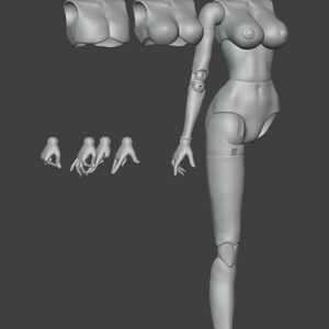May include: A grey articulated doll figure with interchangeable parts, including heads, torsos, hands, and feet. The doll is in a standing pose, with a detailed, smooth surface.