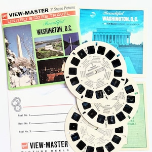 May include: A set of three View-Master reels with black and white images of Washington, D.C. landmarks. The reels are labeled "Beautiful Washington, D.C." and "A View-Master Picture Presentation".