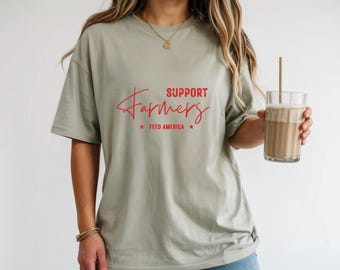 Camiseta gráfica "Apoya a los agricultores", de algodón teñido en prenda, con estampado de la vida en la granja.