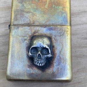 Half jaw skull zippo