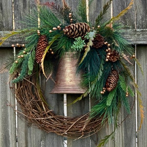 Rustic winter wreath with champagne berries and bell Christmas wreath