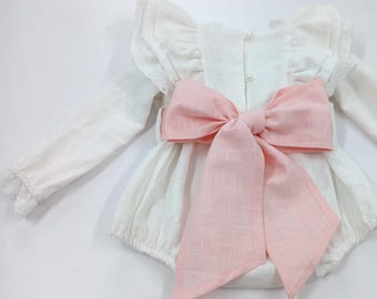 White baby girl romper with pink bow, long sleeve linen christening outfit, boho baptism romper for special occasions.